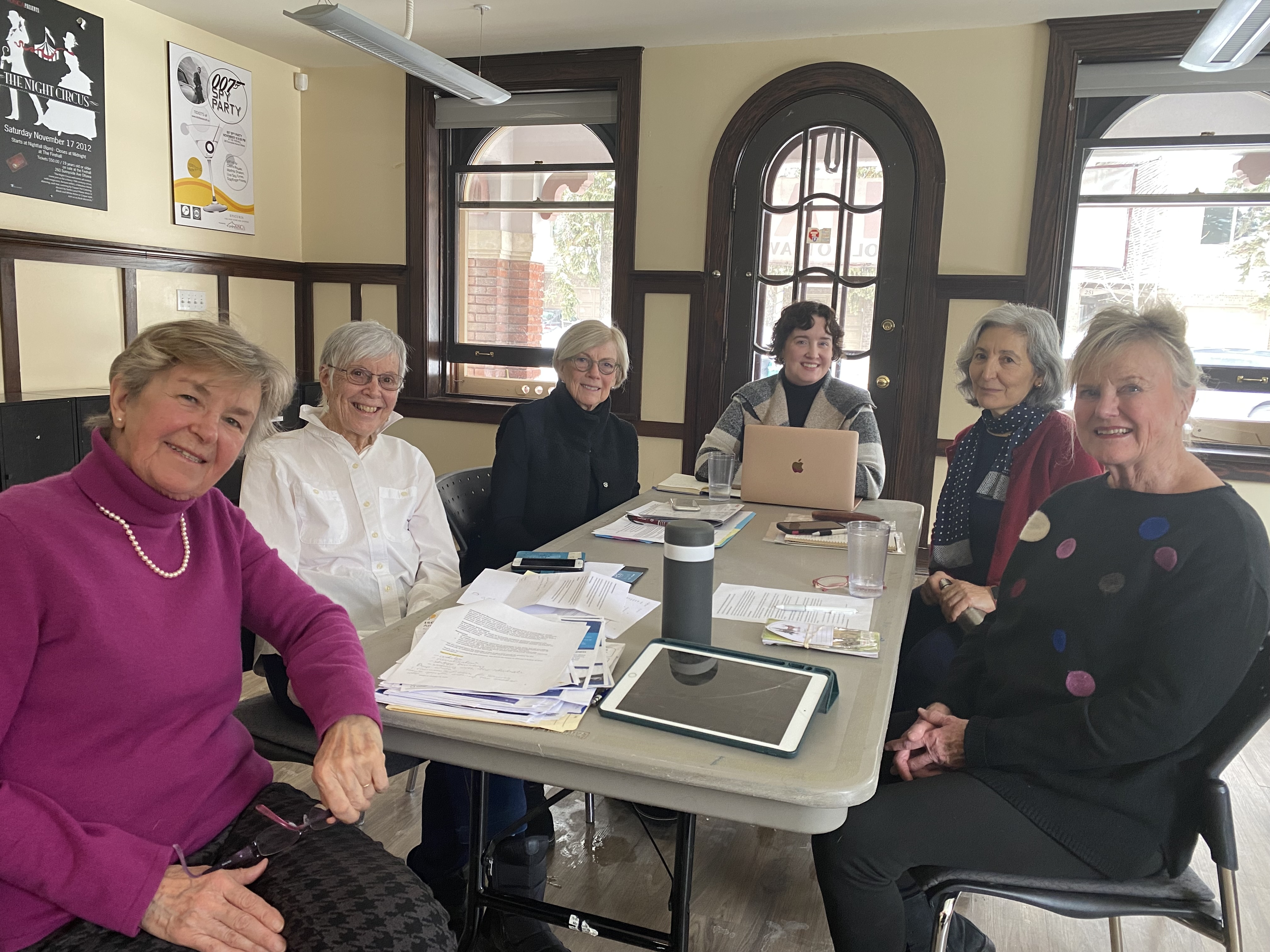 A group of women sitting around a table